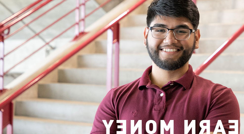 Male student smiling at camera